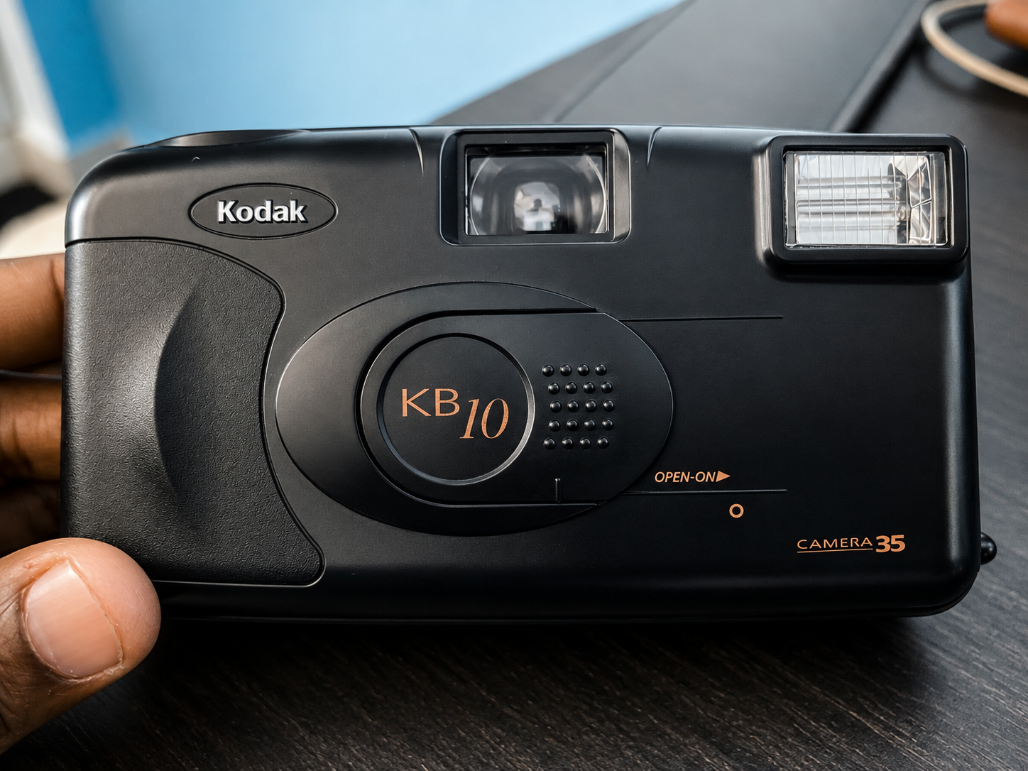 A Kodak KB10 Camera 35 point-and-shoot film camera held in one hand