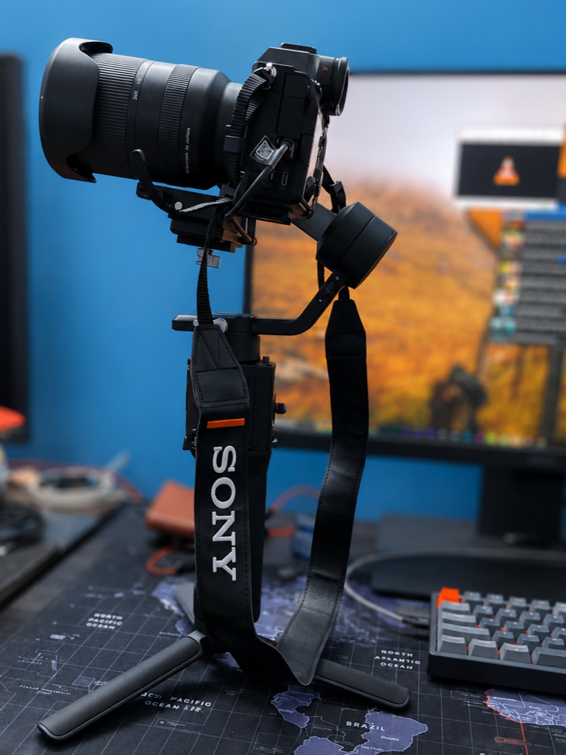The Sony A7 IV mounted on a gimbal with a Tamron zoom attached