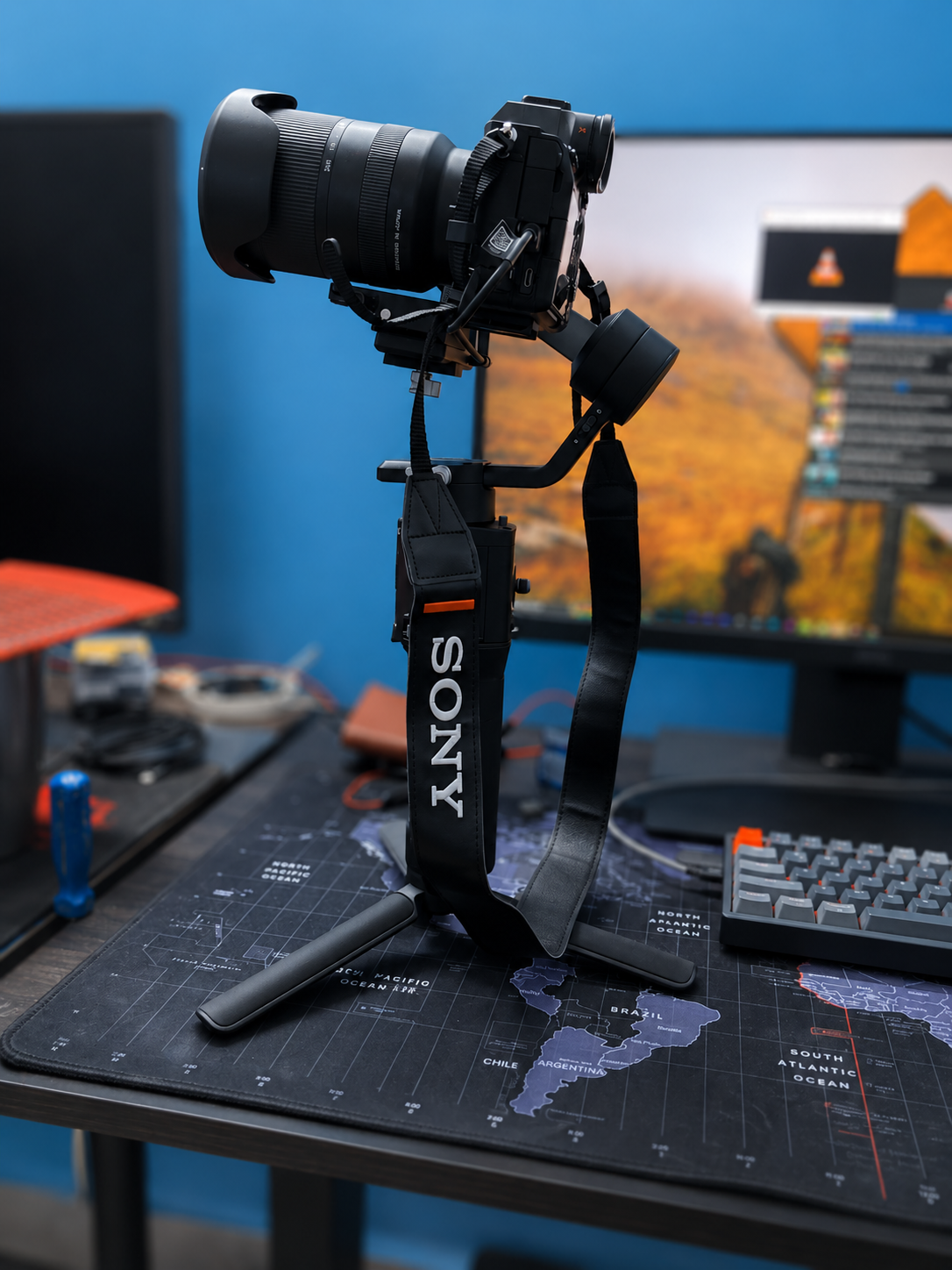 The Sony A7 IV mounted on a gimbal with a Tamron zoom attached